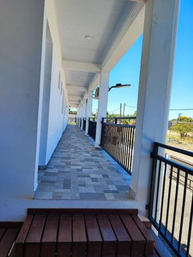 a walkway to the beach on a house at Alojamiento colibrí in La Porteña