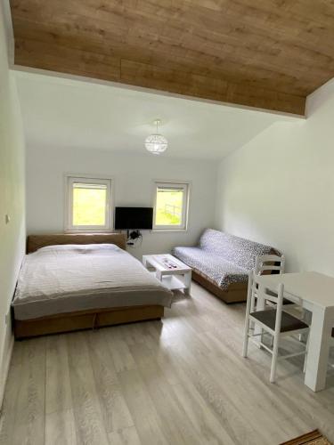 Cama ou camas em um quarto em Apartman-kuća-Žabljak
