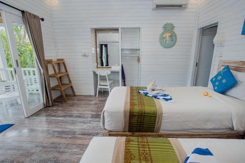 Postel nebo postele na pokoji v ubytování Grand Sea View Lembongan