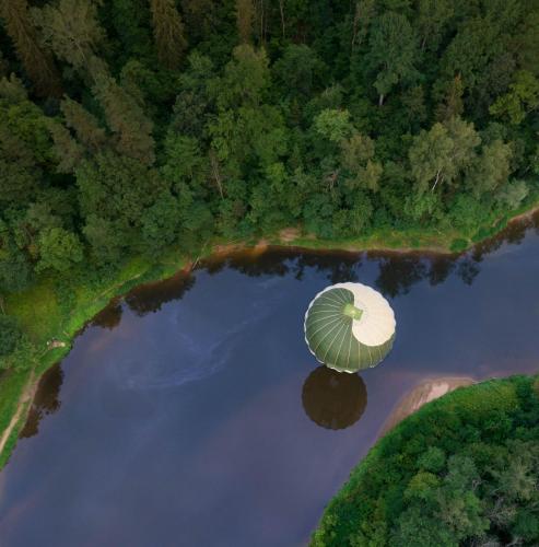 an aerial view of an object in the water at Camping House Aivari in Inčukalns
