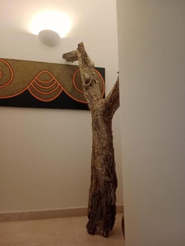 a sculpture of a person with its arms in the air at B&B via Cattedrale 5 in Bitonto