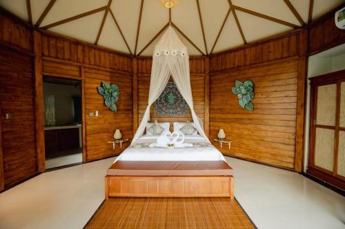 Ένα ή περισσότερα κρεβάτια σε δωμάτιο στο Timbul Highland Villa