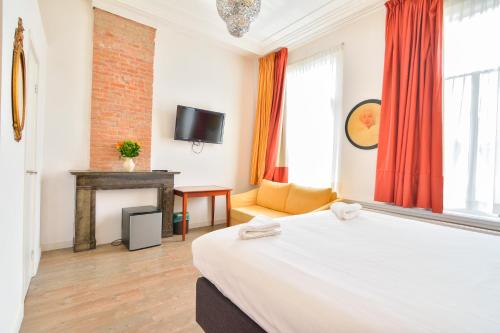Postel nebo postele na pokoji v ubytování Hotel La Belle Vue