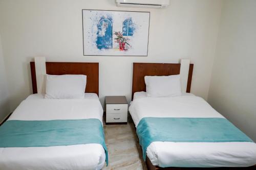 Кровать или кровати в номере Marseilia Beach 4 - Families Only