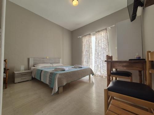 Ένα ή περισσότερα κρεβάτια σε δωμάτιο στο Sigma Hotel