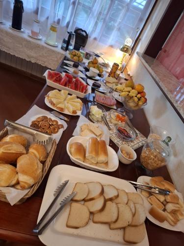 a table with many different types of food on it at Recanto Due Fratelli in Campos do Jordão