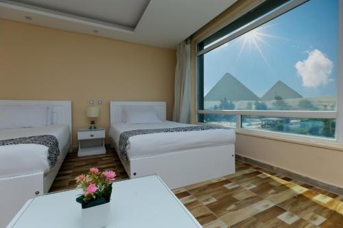 Posezení v ubytování Turquoise Pyramids & Grand Egyptian museum view Hotel