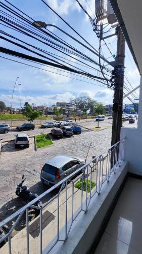 a view of a parking lot with cars and a motorcycle at HOTEL ESTAÇÃO in Diamantina