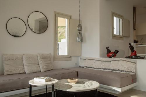 a living room with a couch and a table at Casa Luz in Pyrgos