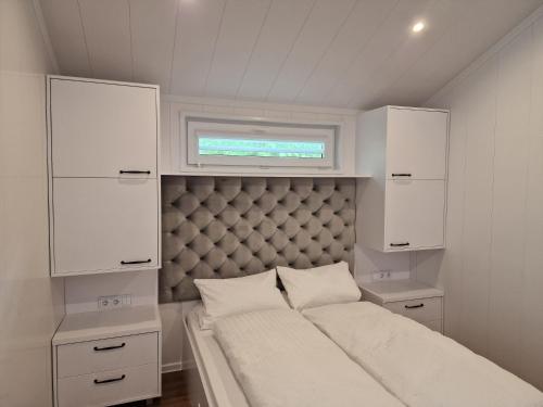 Postel nebo postele na pokoji v ubytování Tiny House in schöner Lage