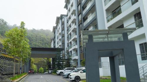 a parking lot with cars parked in front of a building at 3BR, Palas Horizon Resident near Kea Farm Market in Cameron Highlands