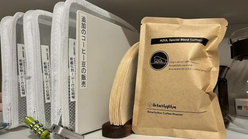 a paper bag sitting next to a box on a counter at Private Villa AZUL 南房総 千倉 海徒歩4分 ペット可 サイクリスト対応 in Minamiboso