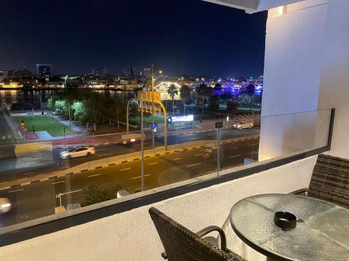 a view of a city street at night from a window at Wow Amazing BurjKhalifa,Sea,Sunset,Ship,Park,Metro View,Private Home 2BHK ,Fully Furnished in Dubai