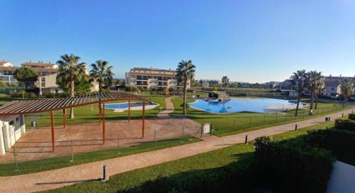 a view of a park with a swimming pool at Apartmento Vista Piscina in Sant Jordi