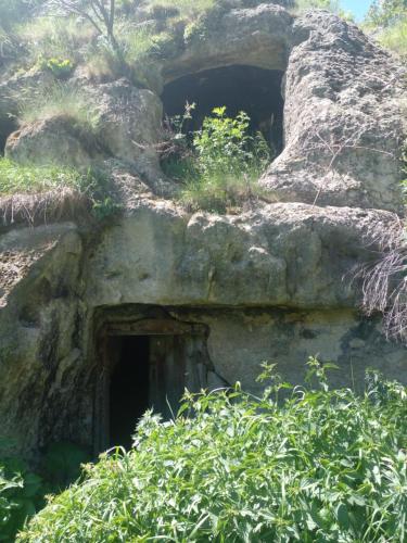 a cave in the side of a rock formation at Vardzia Chachkari Cottage in Gogasheni