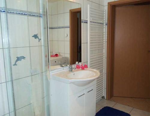 Ένα μπάνιο στο Ferienwohnung Auf dem Sonnenberg