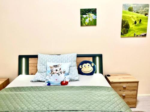 a bedroom with a bed with pillows on it at Oasis Valley in Karlovy Vary