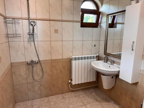a bathroom with a shower and a sink at Villa Azur- Sea View Luxury with Pool near Balchik in Albena