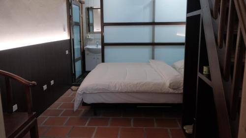 Ένα ή περισσότερα κρεβάτια σε δωμάτιο στο Wuhe Hotel