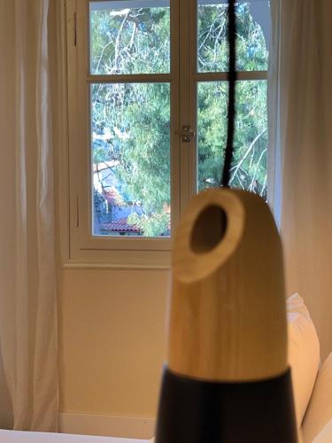 a roll of toilet paper sitting in front of a window at amfiliki in Skiathos Town