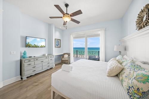 a bedroom with a bed and a window with the ocean at Beachfront Paradise - direct access to the Gulf in Bradenton Beach