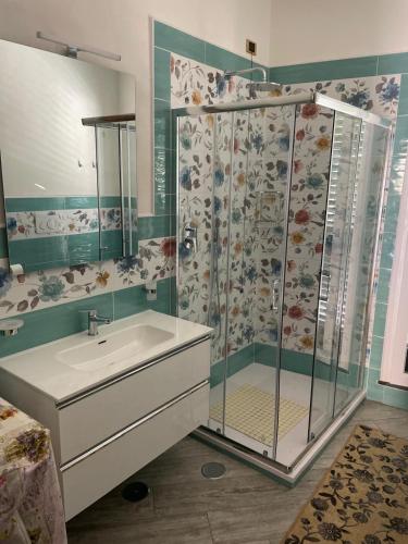 a bathroom with a shower with a sink and a shower at marella in Minori