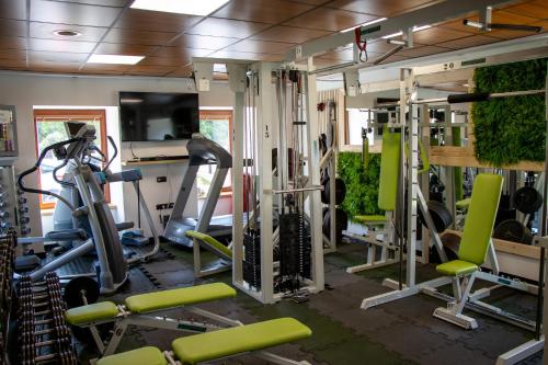 a gym with a lot of tread machines at Kokořín Apartments in Kokořín