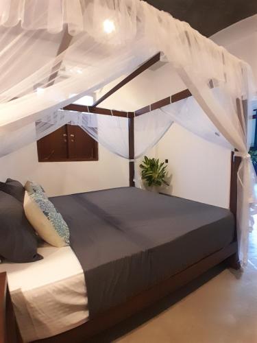 Postel nebo postele na pokoji v ubytování Beach Inns Residences