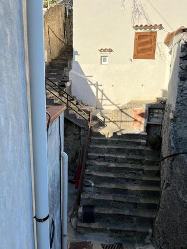 a set of stairs leading up to a building at Song of the sea, Amalfi Coast in Minori