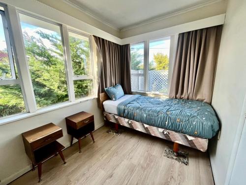 Postel nebo postele na pokoji v ubytování PRIVATE ROOMS IN CENTRAL AUCKLAND