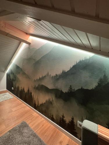 a mural on a wall in a room at Bleibach Chalet in Gutach im Breisgau