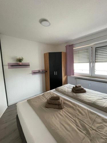 a bedroom with two beds with towels on them at Seehaas1 in Friedrichshafen