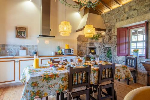 a kitchen with a table with food on it at House Sopo in Vila Nova de Cerveira