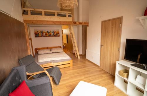 a living room with a couch and a bunk bed at U Koníka in Loket