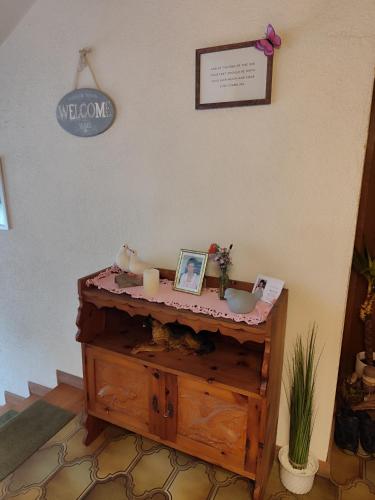 a bathroom with a sink and candles on a table at Privatzimmer Pendl in Abtenau