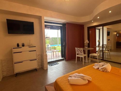 a bedroom with a bed with two towels on it at Oasi verde cavallino in Cavallino di Lecce