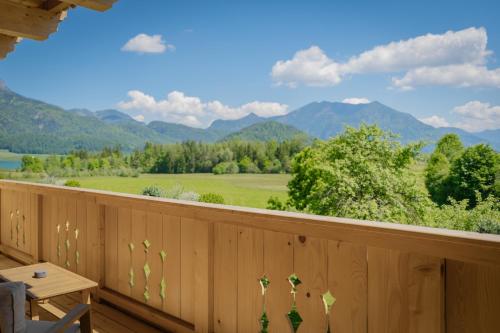 a deck with a view of the mountains at Arnestgut in Strobl