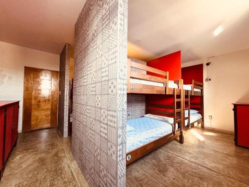 a room with two bunk beds and a wall at Ica Adventures II in Ica