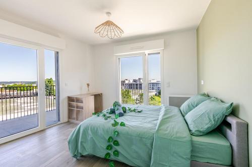 En eller flere senge i et værelse på 2P moderne avec balcon et vue à Massy Palaiseau