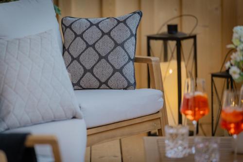 a chair with a pillow on top of a table at Arnestgut in Strobl