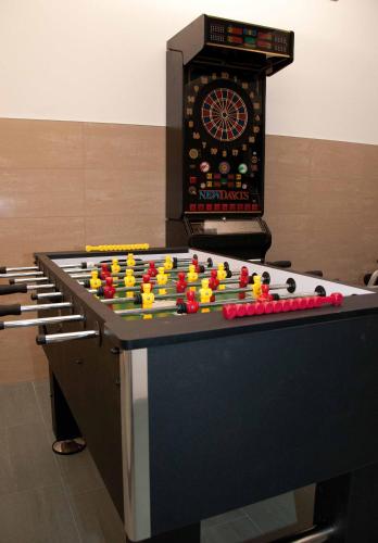 a table with a dart board on top at Seeappartements Bürger in Krumpendorf am Wörthersee