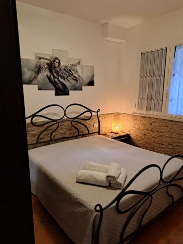 Postel nebo postele na pokoji v ubytování Complesso I Giardini Elisei