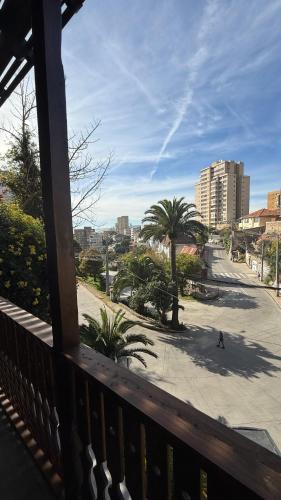 a view from a balcony of a street with palm trees at Tribu in Viña del Mar