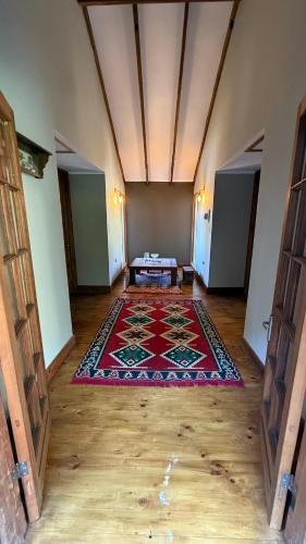 a large room with a red rug on the floor at Tribu in Viña del Mar