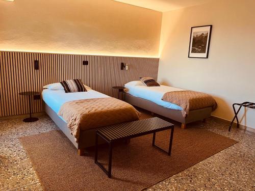 Postel nebo postele na pokoji v ubytování Tilly's Locanda