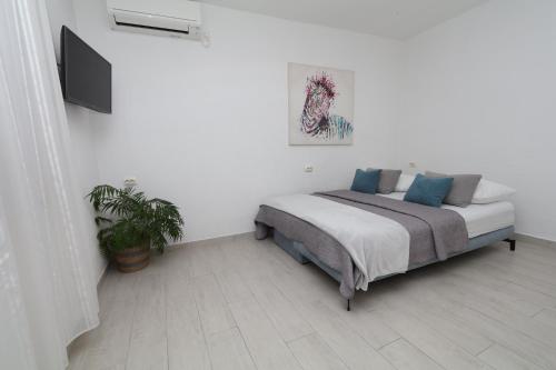 Postel nebo postele na pokoji v ubytování Mamma Mia Apartments