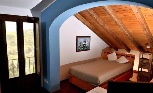 Ένα ή περισσότερα κρεβάτια σε δωμάτιο στο CasaleRusso