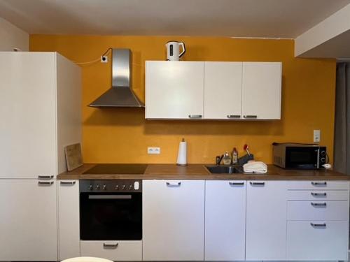 Kuchyň nebo kuchyňský kout v ubytování Gästehaus Sandvoss