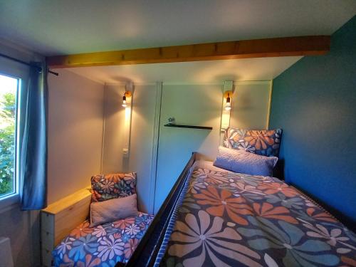 Cama o camas de una habitación en Le Nid