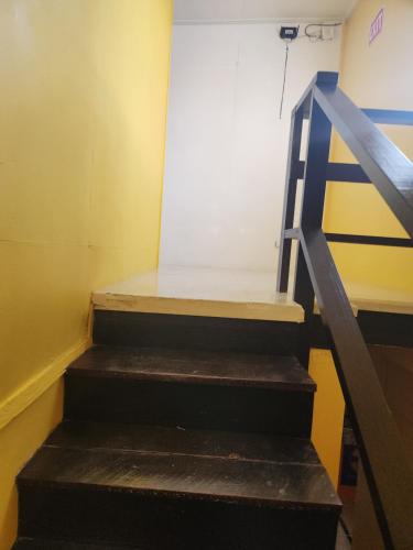 a set of stairs in a room with a door at EL REY Hotel & Restaurant in Belmopan